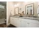 Upscale bathroom featuring double sinks, granite countertops, and a stylish vanity at 287 Flower Farm Dr, Acworth, GA 30101