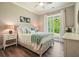Serene bedroom boasts wood-look flooring, ceiling fan, and ample natural light at 287 Flower Farm Dr, Acworth, GA 30101