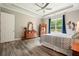 Comfortable primary bedroom with neutral walls and wooden furniture at 287 Flower Farm Dr, Acworth, GA 30101