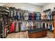Large closet featuring custom racks, a bench, and hardwood floors at 287 Flower Farm Dr, Acworth, GA 30101