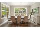 Light and bright dining room with large windows at 287 Flower Farm Dr, Acworth, GA 30101