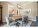 Open dining room with hardwood floors, neutral paint, and views of the entryway at 287 Flower Farm Dr, Acworth, GA 30101
