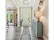 Inviting entryway with hardwood floors, a stylish blue console table and front door at 287 Flower Farm Dr, Acworth, GA 30101