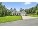 A well-maintained, one-story home featuring gray siding, a two-car garage, and a spacious front yard at 287 Flower Farm Dr, Acworth, GA 30101