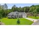 Well-manicured front yard and a charming craftsman-style home with a welcoming front porch at 287 Flower Farm Dr, Acworth, GA 30101
