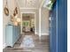 Entryway featuring hardwood floors, a blue front door, and a view into the home's open floor plan at 287 Flower Farm Dr, Acworth, GA 30101