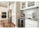 Kitchen featuring granite counters, wine cooler, stainless appliances and white cabinets at 287 Flower Farm Dr, Acworth, GA 30101