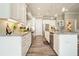 Kitchen with granite counters, stainless appliances, white cabinets, and a breakfast bar at 287 Flower Farm Dr, Acworth, GA 30101