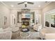 Living room with stone fireplace, recessed lighting, and cozy seating arrangement at 287 Flower Farm Dr, Acworth, GA 30101