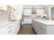 Modern kitchen with stainless steel appliances, white subway tiles, quartz countertop, and hardwood floors at 3900 Danube Ln, Atlanta, GA 30339
