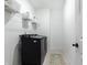 Clean and organized laundry room features a modern washer and dryer and convenient storage at 3900 Danube Ln, Atlanta, GA 30339