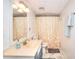 Bright bathroom featuring patterned shower curtain and complementing marble-style flooring at 4915 Millers Trce, Peachtree Corners, GA 30096