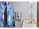 Bathroom featuring a creative shower curtain, hand towels and classic fixtures at 4915 Millers Trce, Peachtree Corners, GA 30096