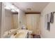Well-lit bathroom with single sink vanity and a shower-tub combo at 4915 Millers Trce, Peachtree Corners, GA 30096