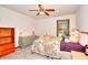 Relaxing bedroom featuring a large window, soft carpet and neutral wall paint at 4915 Millers Trce, Peachtree Corners, GA 30096