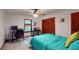 Cozy bedroom featuring neutral carpet, ceiling fan, and large windows offering lots of natural light at 4915 Millers Trce, Peachtree Corners, GA 30096