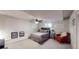 Bedroom with a comfy red chair, window and a bed with pillows at 4915 Millers Trce, Peachtree Corners, GA 30096