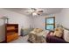 Relaxing bedroom featuring a large window, soft carpet and neutral wall paint at 4915 Millers Trce, Peachtree Corners, GA 30096