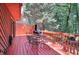 Relaxing deck area with table, chairs, and grill, perfect for outdoor enjoyment at 4915 Millers Trce, Peachtree Corners, GA 30096