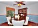 Dining room featuring hardwood floors, and a classic China cabinet, creating a refined setting at 4915 Millers Trce, Peachtree Corners, GA 30096