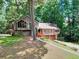 Charming home nestled among lush greenery with a two-car garage and inviting front entrance at 4915 Millers Trce, Peachtree Corners, GA 30096