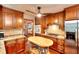 Modern kitchen featuring stainless steel appliances, granite countertops, and center butcher block island at 4915 Millers Trce, Peachtree Corners, GA 30096