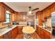 Modern kitchen featuring stainless steel appliances, granite countertops, and center butcher block island at 4915 Millers Trce, Peachtree Corners, GA 30096