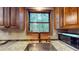 Kitchen sink and counter featuring stainless appliances, granite countertops, and natural lighting at 4915 Millers Trce, Peachtree Corners, GA 30096