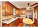 Modern kitchen featuring stainless steel appliances, granite countertops, and center butcher block island at 4915 Millers Trce, Peachtree Corners, GA 30096