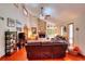 Spacious living room with stone fireplace, vaulted ceilings, hardwood floors, and natural light at 4915 Millers Trce, Peachtree Corners, GA 30096
