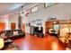 Spacious living room with stone fireplace, vaulted ceilings, hardwood floors, and natural light at 4915 Millers Trce, Peachtree Corners, GA 30096