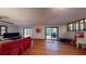 Spacious living room with hardwood floors and sliding door access to the back deck at 4915 Millers Trce, Peachtree Corners, GA 30096