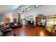 Spacious living room with stone fireplace, vaulted ceilings, hardwood floors, and natural light at 4915 Millers Trce, Peachtree Corners, GA 30096