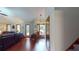 Inviting living room featuring hardwood floors, a leather sofa and large windows at 4915 Millers Trce, Peachtree Corners, GA 30096