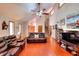 Spacious living room with stone fireplace, vaulted ceilings, hardwood floors, and natural light at 4915 Millers Trce, Peachtree Corners, GA 30096