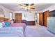 Spacious main bedroom with large closet, soft carpet and ceiling fan at 4915 Millers Trce, Peachtree Corners, GA 30096