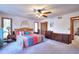 Spacious main bedroom with a large closet, soft carpet and ceiling fan at 4915 Millers Trce, Peachtree Corners, GA 30096