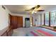 Spacious main bedroom with closet, ceiling fan, and large window for natural light at 4915 Millers Trce, Peachtree Corners, GA 30096