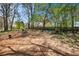 Large, secluded backyard with mature trees and a fire pit, perfect for entertaining at 500 Rosehill Dr, Mcdonough, GA 30253