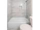 Bathroom featuring a tiled shower and tub, complemented by a modern toilet at 500 Rosehill Dr, Mcdonough, GA 30253