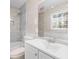 Bright bathroom featuring neutral tile, shower and tub combo, and a large mirror at 500 Rosehill Dr, Mcdonough, GA 30253
