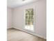 Bedroom with light wood-look floors, complemented by a large window at 500 Rosehill Dr, Mcdonough, GA 30253