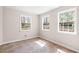 Bright bedroom featuring tile flooring and two large windows offering plenty of natural light at 500 Rosehill Dr, Mcdonough, GA 30253