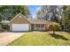 Charming single-story home with a well-maintained front yard and attached garage at 500 Rosehill Dr, Mcdonough, GA 30253
