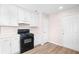 Functional kitchen featuring white cabinets and modern appliances at 500 Rosehill Dr, Mcdonough, GA 30253