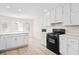 Efficient kitchen with white cabinets and stainless steel appliances at 500 Rosehill Dr, Mcdonough, GA 30253