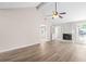 Spacious living room with hardwood floors and a charming fireplace at 500 Rosehill Dr, Mcdonough, GA 30253