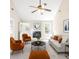 Inviting living room featuring a ceiling fan, fireplace, and cozy furniture at 500 Rosehill Dr, Mcdonough, GA 30253