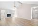 Open living room showcasing hardwood floors and a fireplace at 500 Rosehill Dr, Mcdonough, GA 30253