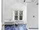 Bright bathroom with a freestanding tub and separate tiled shower with blue tile flooring at 966 Blue Ridge Ne Ave, Atlanta, GA 30306